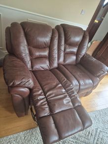Brown two seater leather recliner