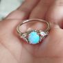 Ring made of 925 silver with oval opal of blue shade and cubic zirconia. Image 4