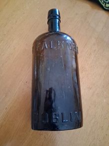 Antique Francis Faulkner Dublin black glass whiskey bottle