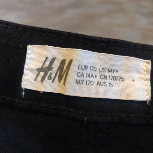 Black stretchy jeans with white stripes, size S, like new