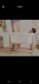 A sleek Babybjorn cradle that gently and silently rocks to soothe your baby.