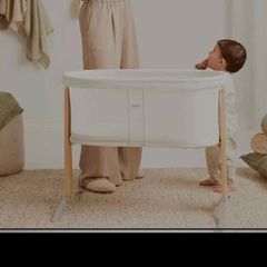 A sleek Babybjorn cradle that gently and silently rocks to soothe your baby.