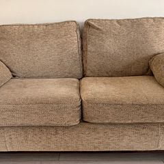 Arnotts 2-seater sofa bed finished in a beige textured