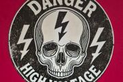 Danger high voltage , vintage style metal sign .