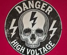 Danger high voltage , vintage style metal sign .
