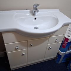 Bathroom sink and cabinet