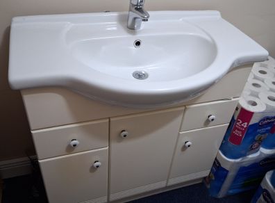 Bathroom sink and cabinet