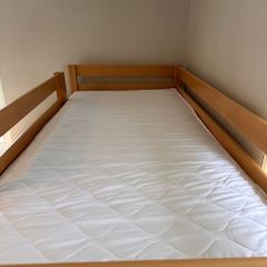 Bunk bed with attached slide and mattresses