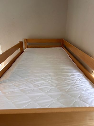 Bunk bed with attached slide and mattresses