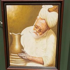 Original framed painting of a Pakistani man at a potter's wheel, D18
