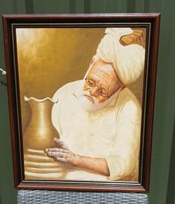 Original framed painting of a Pakistani man at a potter's wheel, D18