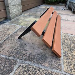Wall mounted outdoor plastic composite bench with a rust resistant frame