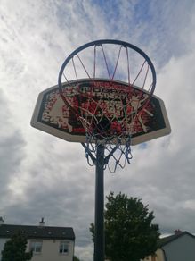 Basketball stand and two basketballs