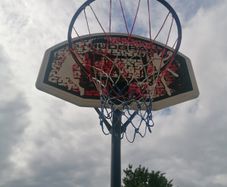 Basketball stand and two basketballs