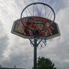 Basketball stand and two basketballs