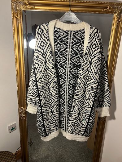 Reversible knitted piece cardigan, a structured jacket, or a coat. Very warm.