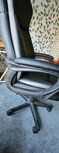 High back leather executive office/ Desk Chair- adjustable height and padded arms.