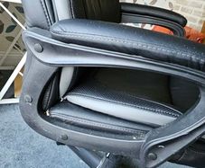 High back leather executive office/ Desk Chair- adjustable height and padded arms.
