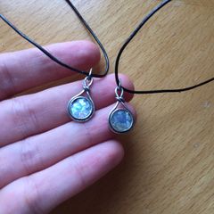 2 x silver pendants with vulcanic glass