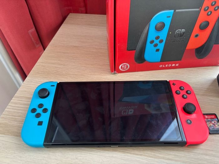 Nintendo Switch OLED (Neon Blue/Red) + Mario Kart 8 Deluxe + Super Mario Bros. W