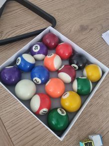 pool balls, triangle and chalk