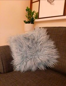 Retro 70s style shaggy turquoise throw pillow