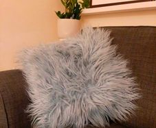 Retro 70s style shaggy turquoise throw pillow
