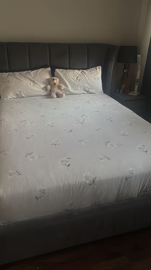 Reduced kingsize bed frame with matching curtains and leather armchair