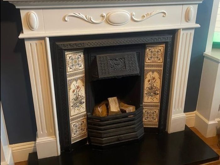 cast iron fireplace with timber surround