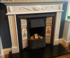 cast iron fireplace with timber surround