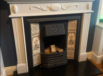 cast iron fireplace with timber surround