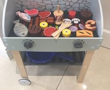 wooden bbq with food