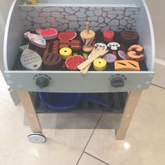 wooden bbq with food
