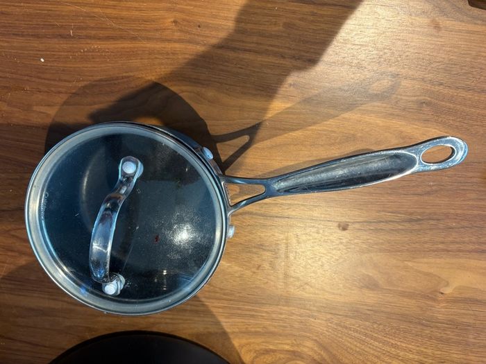 Set of All Clad pots and pans