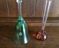 Green glass bell and a coral bubble glass bud vase