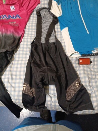 2 cycling shirts 1 is cube worth easily 50 euro and is brand new and pants with padding for on the saddle brand new never worn the second shirt is the official astana team training shirt also brand new  is the  would like to sell all together for a good p