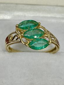 Silver ring with emeralds