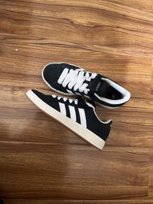 Black and white adidas shoes