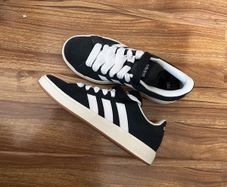 Black and white adidas shoes