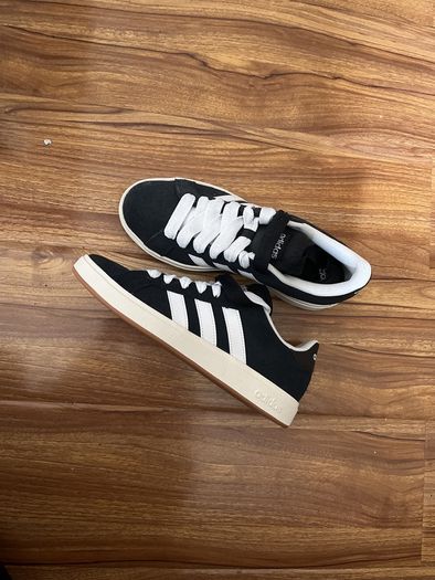 Black and white adidas shoes
