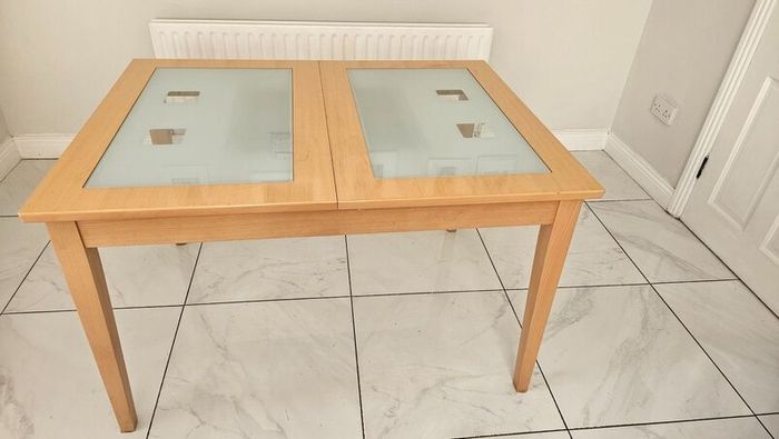 Extendable Light Wood Dining Table with Glass Pane