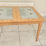 Extendable Light Wood Dining Table with Glass Pane Image 2
