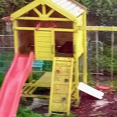 Garden playhouse with slide, swings, look out tower, picnic table