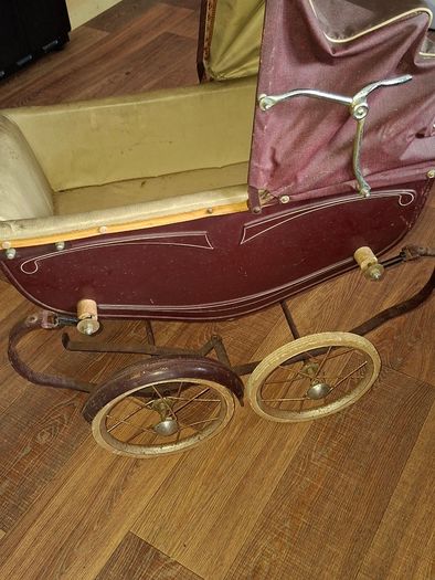 Antique Burgundy Doll's Pram, Manufactured by Walker around the 1940s, It features a Coach-Built Style Carriage with distinctive Wire-Spoke Wheels and Hard Rubber Tires Collection Only