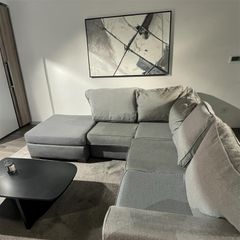 Grey corner sofa with matching footstool