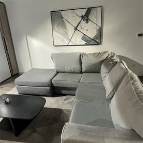 Grey corner sofa with matching footstool