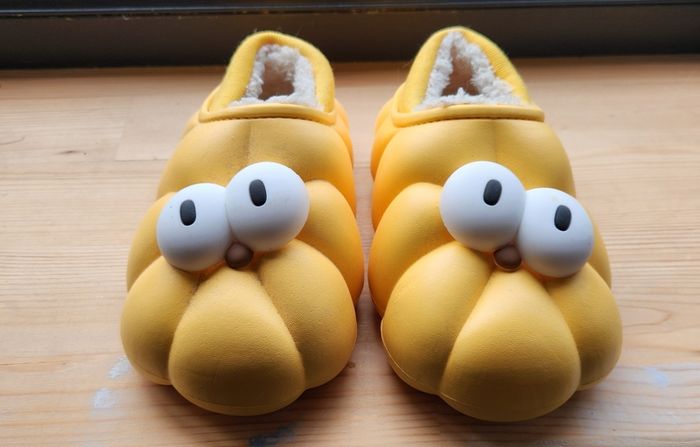 Child's plush lined yellow funny eyes slippers