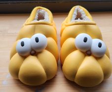 Child's plush lined yellow funny eyes slippers
