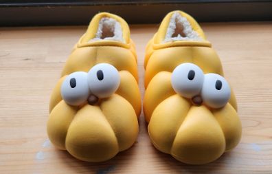 Child's plush lined yellow funny eyes slippers