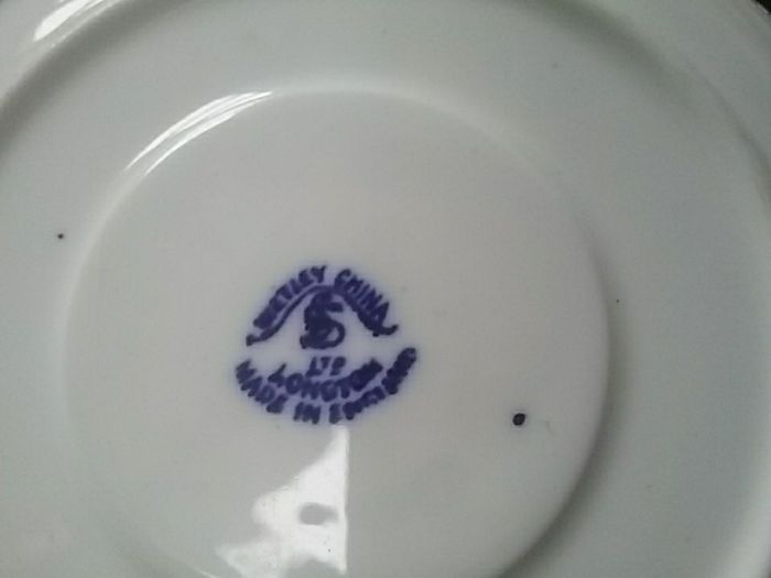 Four Blue Willow Saucers